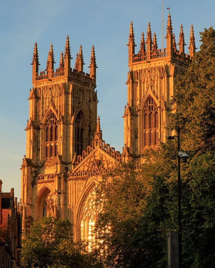 York Minster twin towers glowing in golden sunset light